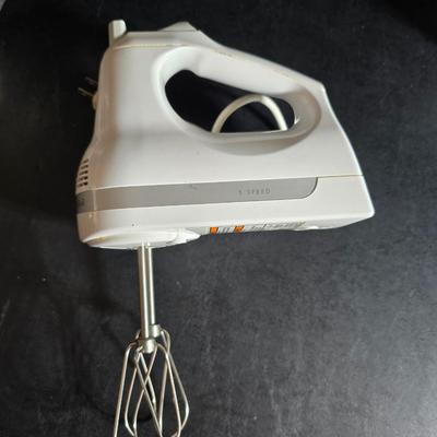 KitchenAid handmixer with new KitchenAid measuring cups, stainless spoons, and a nice stainless bowl