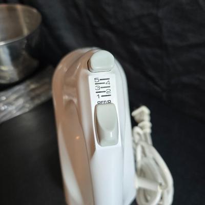 KitchenAid handmixer with new KitchenAid measuring cups, stainless spoons, and a nice stainless bowl