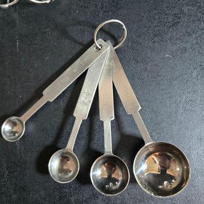 KitchenAid handmixer with new KitchenAid measuring cups, stainless spoons, and a nice stainless bowl