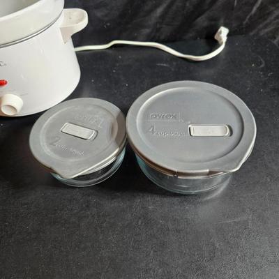 Small Rival crockpot with glass lidded leftover containers, quilted hot pads, spoon rest and more