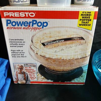 Date night -Movie night! Presto pop Microwave popper, Popcorn bowl, Snuggie blanket, four Movies on DVD, and two large cups with a pitcher
