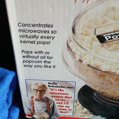 Date night -Movie night! Presto pop Microwave popper, Popcorn bowl, Snuggie blanket, four Movies on DVD, and two large cups with a pitcher