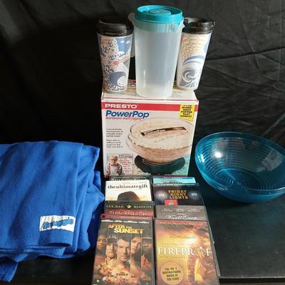 Date night -Movie night! Presto pop Microwave popper, Popcorn bowl, Snuggie blanket, four Movies on DVD, and two large cups with a pitcher