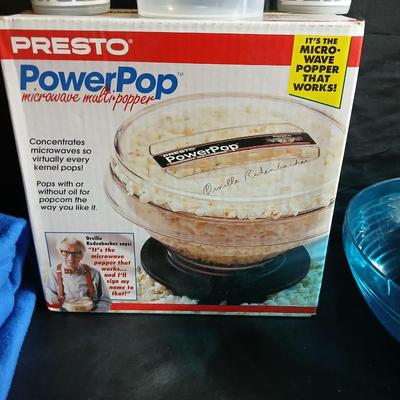 Date night -Movie night! Presto pop Microwave popper, Popcorn bowl, Snuggie blanket, four Movies on DVD, and two large cups with a pitcher