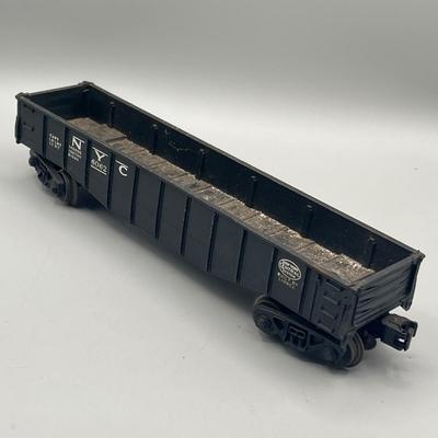 Lot 234: Vintage Lionel Train Cars - Refrigerated Milk Car, Explosives Car Pieces, Caboose and More