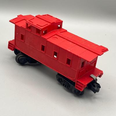 Lot 234: Vintage Lionel Train Cars - Refrigerated Milk Car, Explosives Car Pieces, Caboose and More