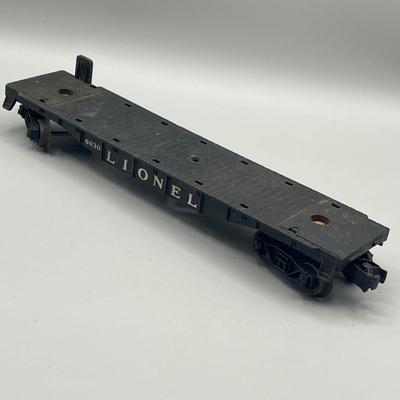 Lot 234: Vintage Lionel Train Cars - Refrigerated Milk Car, Explosives Car Pieces, Caboose and More