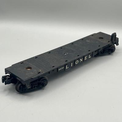 Lot 234: Vintage Lionel Train Cars - Refrigerated Milk Car, Explosives Car Pieces, Caboose and More