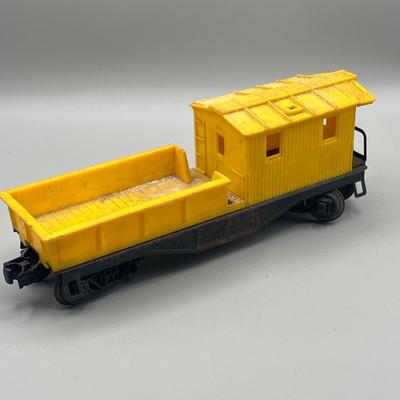 Lot 234: Vintage Lionel Train Cars - Refrigerated Milk Car, Explosives Car Pieces, Caboose and More