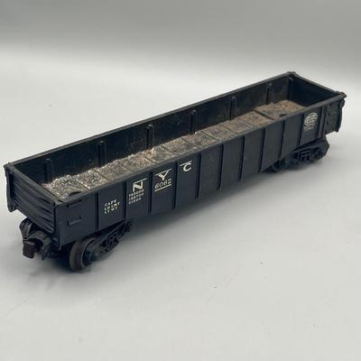 Lot 234: Vintage Lionel Train Cars - Refrigerated Milk Car, Explosives Car Pieces, Caboose and More