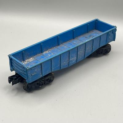 Lot 234: Vintage Lionel Train Cars - Refrigerated Milk Car, Explosives Car Pieces, Caboose and More