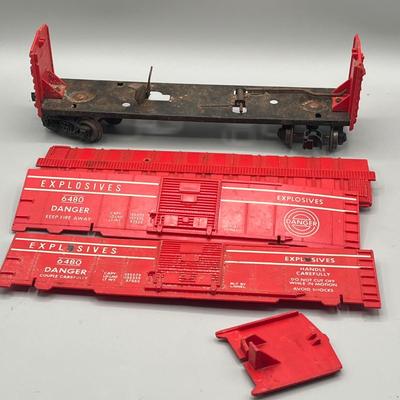 Lot 234: Vintage Lionel Train Cars - Refrigerated Milk Car, Explosives Car Pieces, Caboose and More