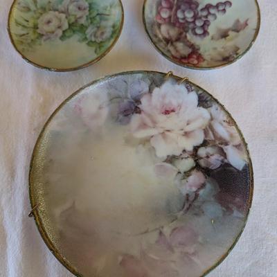 Some beautiful hand painted plates, salt and pepper shakers,