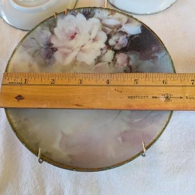 Some beautiful hand painted plates, salt and pepper shakers,