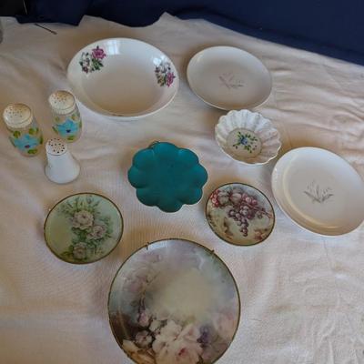 Some beautiful hand painted plates, salt and pepper shakers,