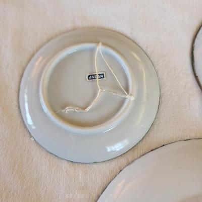 Some beautiful hand painted plates, salt and pepper shakers,