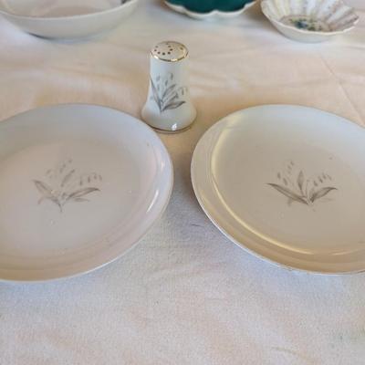 Some beautiful hand painted plates, salt and pepper shakers,