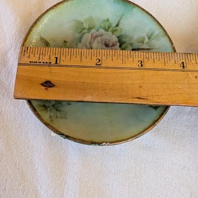 Some beautiful hand painted plates, salt and pepper shakers,