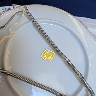 Some beautiful hand painted plates, salt and pepper shakers,