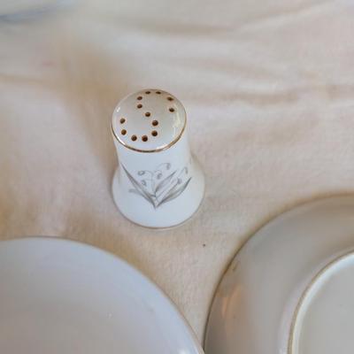 Some beautiful hand painted plates, salt and pepper shakers,