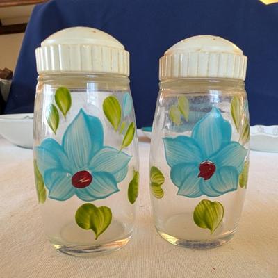 Some beautiful hand painted plates, salt and pepper shakers,