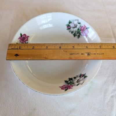 Some beautiful hand painted plates, salt and pepper shakers,