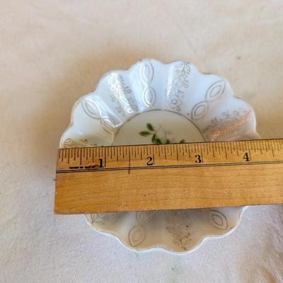 Some beautiful hand painted plates, salt and pepper shakers,