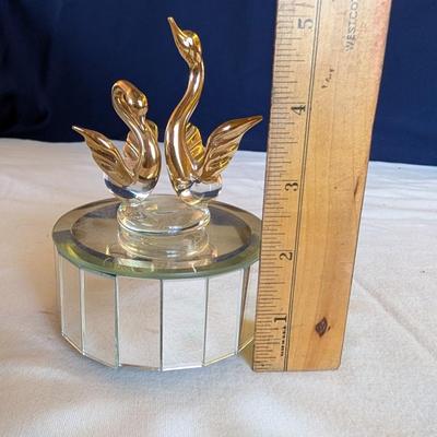 Musical swans, sleeping angel, 40th anniversary plaque, a gold leaf scarf holder.