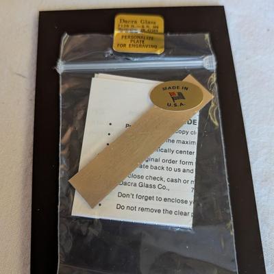 Musical swans, sleeping angel, 40th anniversary plaque, a gold leaf scarf holder.