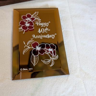 Musical swans, sleeping angel, 40th anniversary plaque, a gold leaf scarf holder.