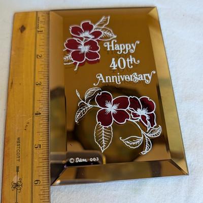 Musical swans, sleeping angel, 40th anniversary plaque, a gold leaf scarf holder.