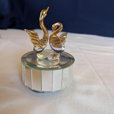 Musical swans, sleeping angel, 40th anniversary plaque, a gold leaf scarf holder.