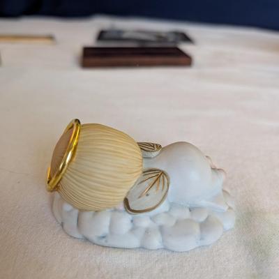 Musical swans, sleeping angel, 40th anniversary plaque, a gold leaf scarf holder.