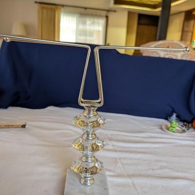 Marble base, glass middle design with gold tone arms. Clear glass diamond point dish with marble base.