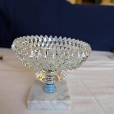 Marble base, glass middle design with gold tone arms. Clear glass diamond point dish with marble base.