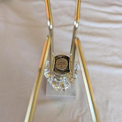 Marble base, glass middle design with gold tone arms. Clear glass diamond point dish with marble base.