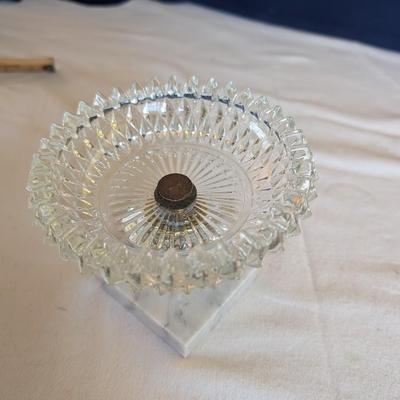 Marble base, glass middle design with gold tone arms. Clear glass diamond point dish with marble base.