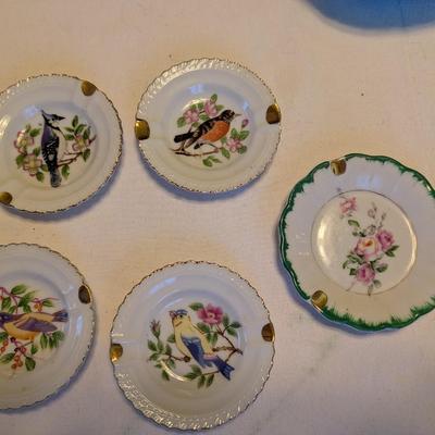 Five small vintage pretty ashtrays.