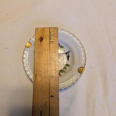 Five small vintage pretty ashtrays.