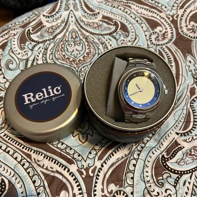 Sale Photo Thumbnail #264: Relic watch that comes with original tin and extra links (not shown) to adjust the fit to your liking.  Will need a new watch battery.

*shipping available at buyers expense