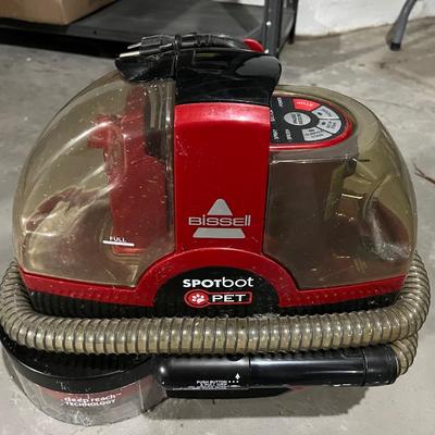 Sale Photo Thumbnail #328: Bissel spot bot for cleaning small messes from pets.  Perfect for small to medium pets and the small design of the machine makes it ideal for spot cleaning and getting into hard to reach places.
