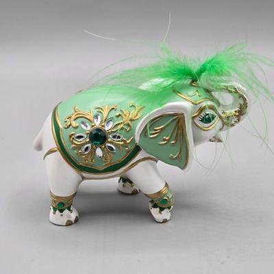 LOT 41: Two White Elephant Ceramic Tea Light Candle Holders, Carved Wooden Elephant, Feng Shui Elephant, and Hamilton Collection Elephant...