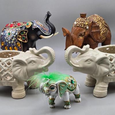 LOT 41: Two White Elephant Ceramic Tea Light Candle Holders, Carved Wooden Elephant, Feng Shui Elephant, and Hamilton Collection Elephant...