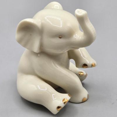 LOT 42: Lenox Victorian Lady of Fashions Tennis At Traymore, Baby Elephant, Prince of Jewels, and Woodland Collection Vase