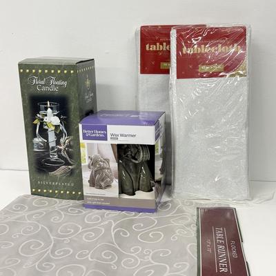 LOT 91: Elephant Wax Warmer, NIP Cloth Tablecloths & Floating Candle