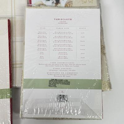 LOT 120: Five NIP Round 70” White Winter Plaid Table Cloths