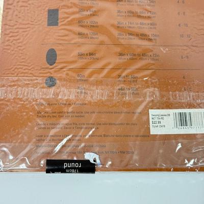 LOT 122: Four NIP Round Tablecloths