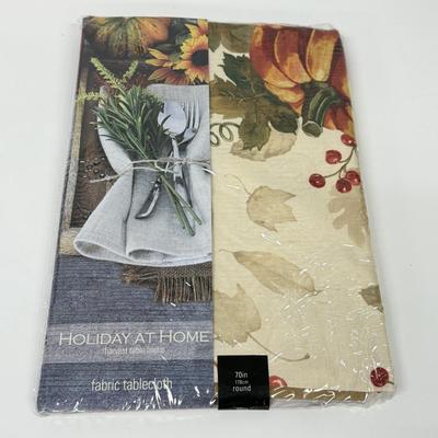 LOT 122: Four NIP Round Tablecloths