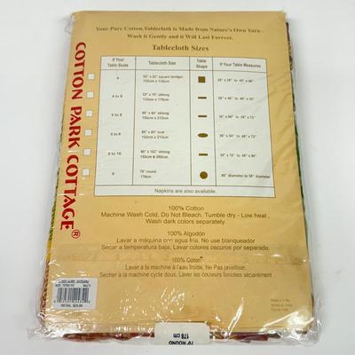 LOT 122: Four NIP Round Tablecloths