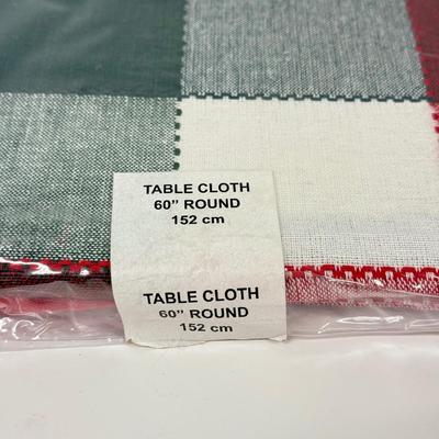 LOT 122: Four NIP Round Tablecloths